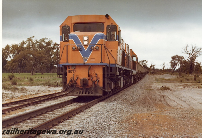 P15893
N class 1877 and another diesel loco, in Westrail orange with blue and white stripe, double heading bauxite train, rural setting, front and partial side view
