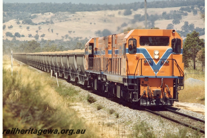 P15900
N class 1876 and another diesel loco, both in Westrail orange with blue and white stripe, double heading bauxite train, rural setting, side and front view
