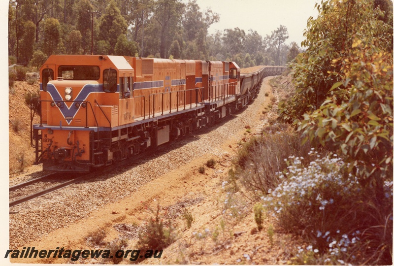 P15901
N class 1876 and another diesel loco, both in Westrail orange with blue and white stripe, double heading bauxite train, rural setting, front and side view
