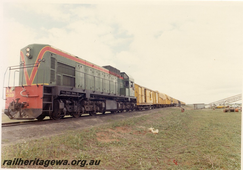 P15918
AA class 1519, in green with red and yellow stripe livery, heading goods train, front and side view
