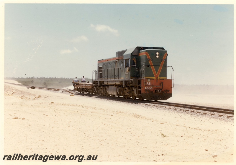 P15920
AB class 1535, flat top wagon with workmen, sledding, rural setting, side and front view
