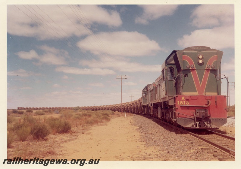 P15931
A class 1513, with A class 1514 diesel loco, both in green with red and yellow livery, double heading a WMC iron ore train, side and front view
