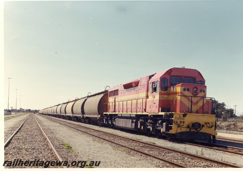 P15937
L class 262, in International safety orange livery, on freight train, side and front view
