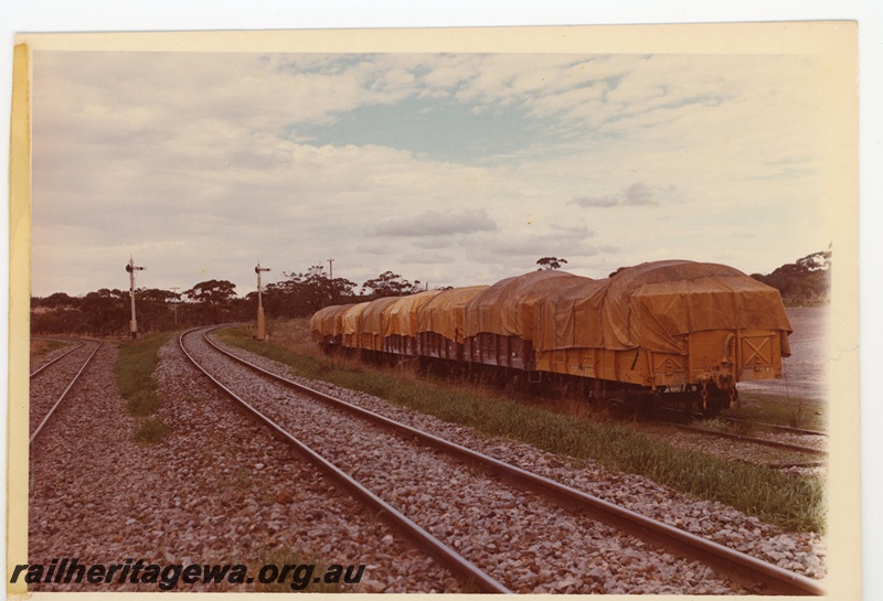 P15972
Rake of covered goods wagons, two semaphore signals, side and end view
