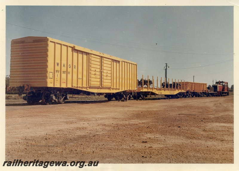 P16038
E class 30, on rake comprising WV class 30701 van, later reclassified WBAX, WF class 30036 flat wagon, WO class wagon, on narrow gauge transfer bogies, end and side view
