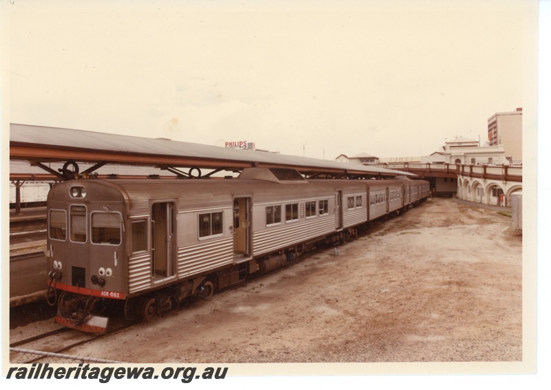 P16052
Three rail car set headed by ADK class 682, in stainless steel, Horseshoe Bridge, Perth station, front and side view
