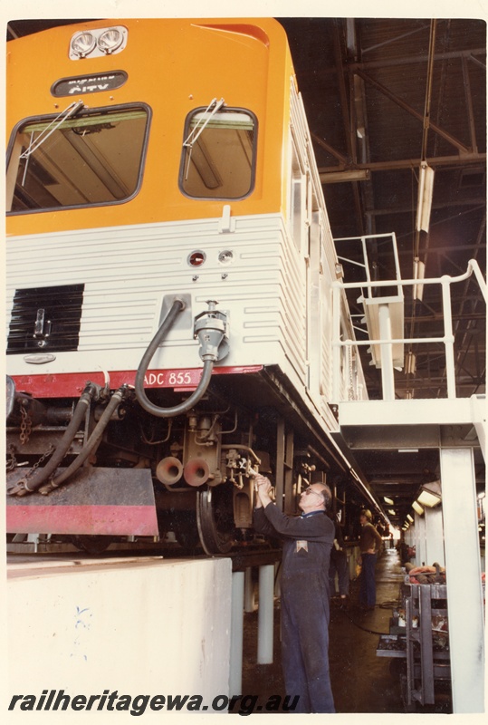 P16065
A fitter working on the brake piping system of ADC class 855 railcar trailer at Claisebrook Depot.
