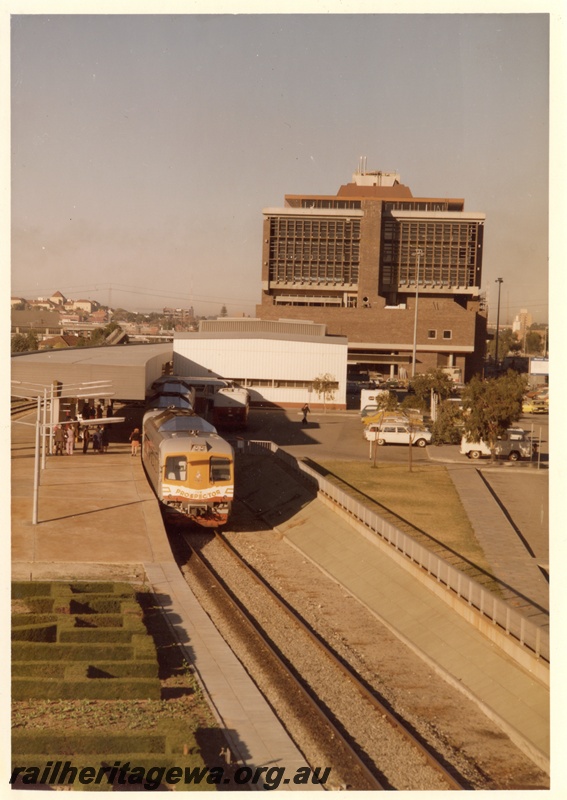 P16066
An overhead view of the first series Prospector pictured at Perth Terminal with the temporary Terminal building and the new administrative building in the background. 
