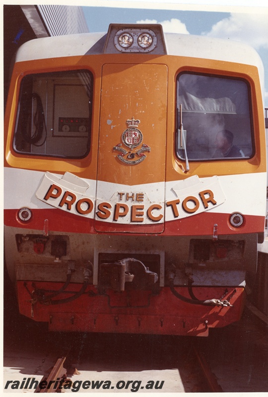 P16071
A front on view of a Prospector railcar with the WAGR Crest mounted in the middle of the door and painted red in the lower front.
