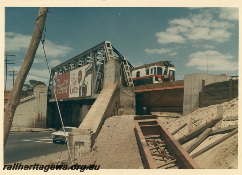 P16084
A suburban railcar travelling over the Mount Lawley subway as works are in progress to provide additional strengthening of the subway for standard gauge traffic.
