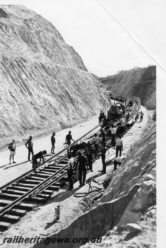 P16107
A group of railway workers hand laying track in a cutting in the Avon Valley.
