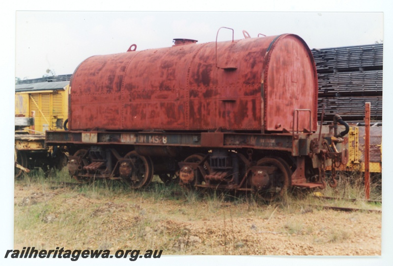 P16146
QW class 14528 bogie tank wagon, stowed at Dwellingup, PN line, in HVR ownership, side and end view
