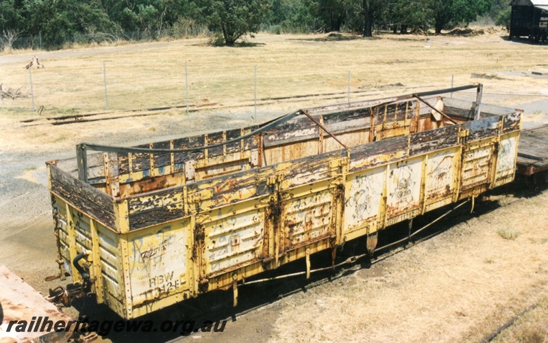 P16154
3 of 3 views of RBW class 11212, yellow livery, in neglected condition, Midland, elevated end and side view
