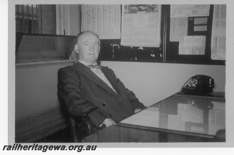 P16156
Station Master, Mr. Harold Ivo Maldon, in his office, in his station master's uniform

