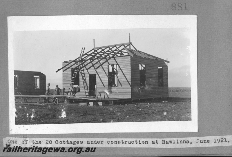 P16162
Commonwealth Railways (CR), weatherboard cottage under construction, two builders, one of twenty houses built at Rawlinna, TAR line
