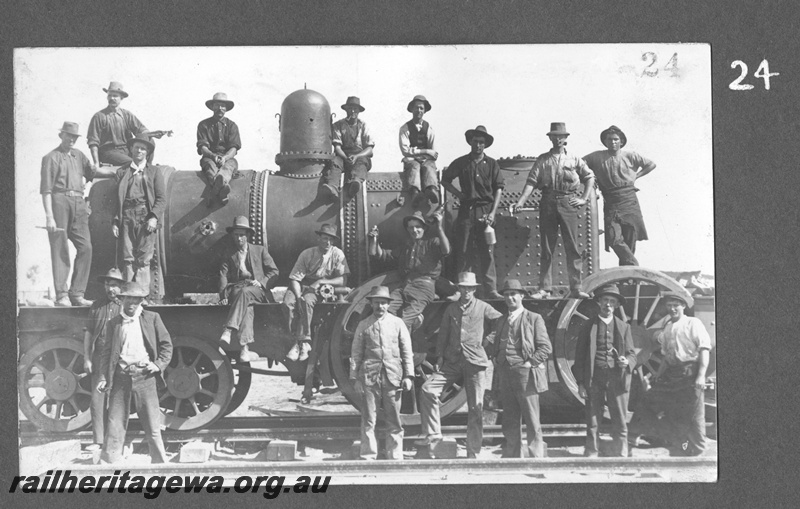P16164
Commonwealth Railways (CR), Q class steam loco, later reclassified as D class, being assembled, workers on and in front of loco, side view, c1912

