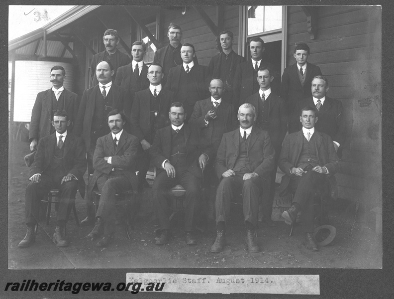 P16167
Commonwealth Railways (CR), group photograph of Kalgoorlie staff, taken outside weatherboard building
