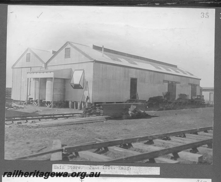 P16168
Commonwealth Railways (CR), main store building, two water tanks, pile of timber, track, Kalgoorlie, TAR line
