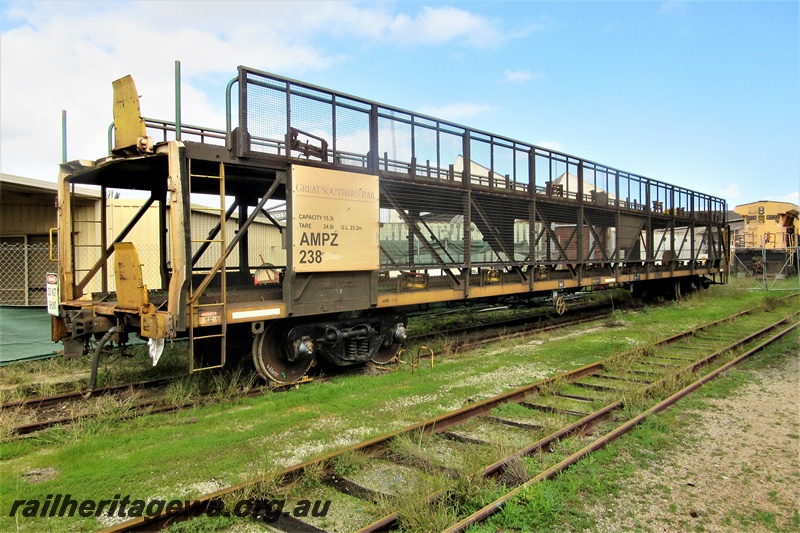 P16194
Great Southern Rail car transporter AMPZ class 238, parked on the track passing through the Rail Transport Museum awaiting servicing at UGL, end and side view
