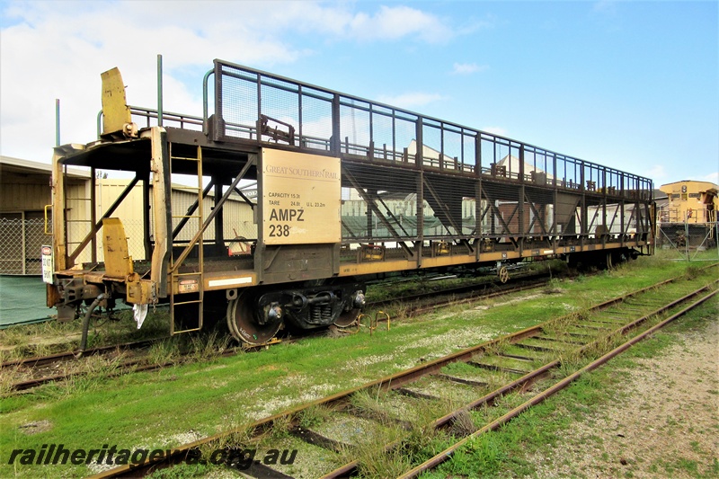 P16194
Great Southern Rail car transporter AMPZ class 238, parked on the track passing through the Rail Transport Museum awaiting servicing at UGL, end and side view
