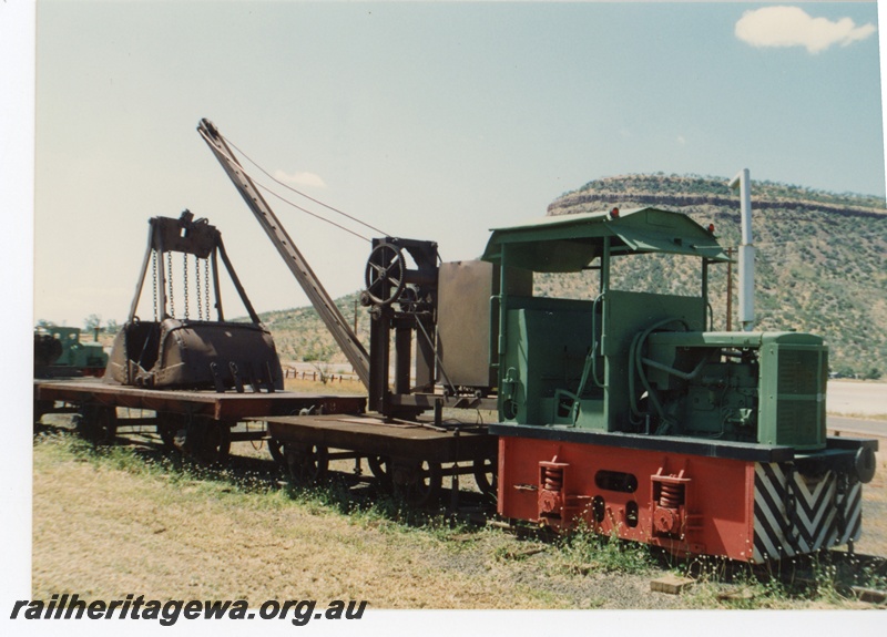 P16200
PWD loco, PW 26, Wyndham, side and front view, coupled to a crane wagon .
