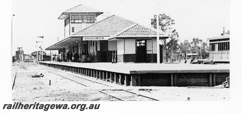 P16210
Station building, signal box, platform, bracket signal, Brunswick Junction, SWR line, c1950
