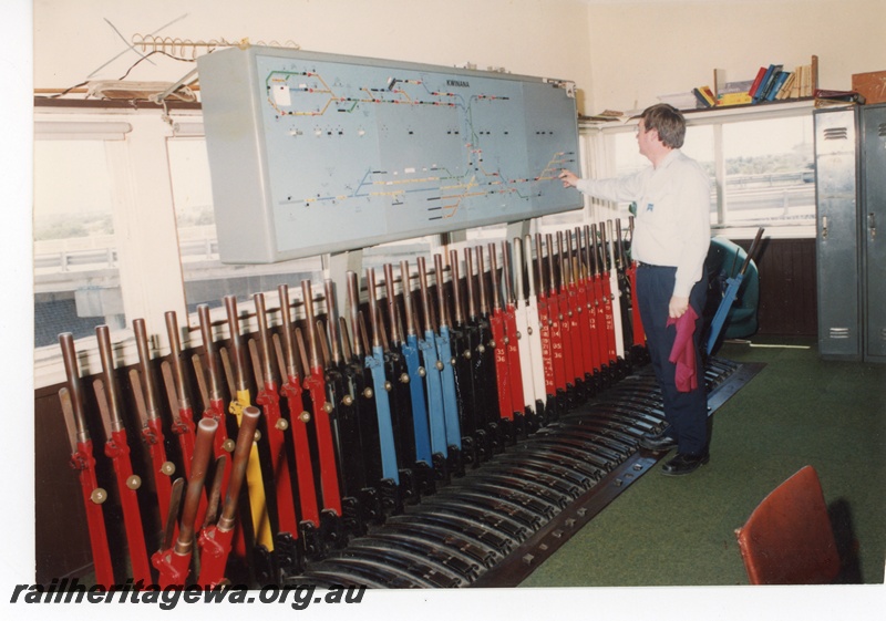 P16250
Interior of signal box, frame containing 40 levers, signalman, Kwinana
