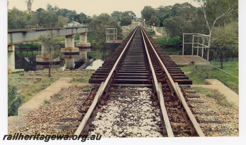 P16257
Rail tracks over bridge showing expansion joints, safety platforms, adjacent concrete and steel bridge, Swan River, Guildford, ER line
