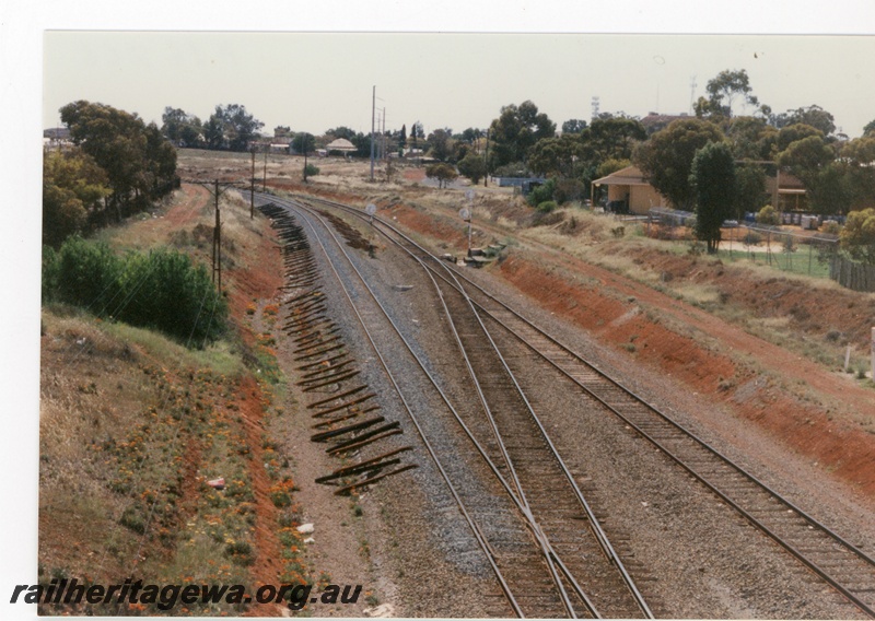 P16266
Crossover on the standard gauge, sleepers lying alongside track, houses, leaving Kalgoorlie, TAR line
