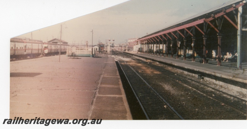 P16304
Fremantle Railway Station showing the island platform in the foreground and stabled railcars to the left again. Note the full length roof on the main platform.
