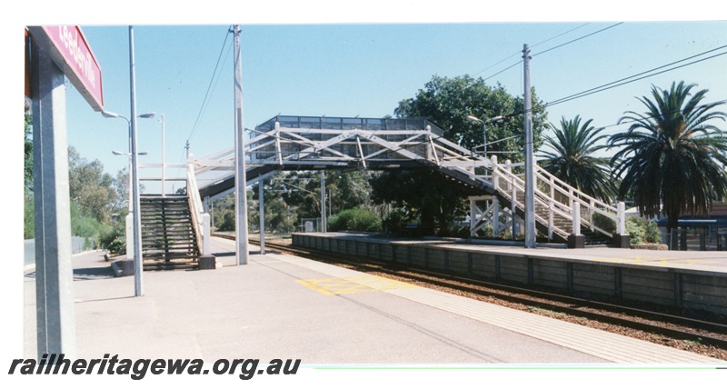 P16309
Overhead footbridge, platforms, lamps, station sign (part), West Leederville station, ER line
