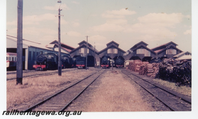P16324
Steam locos, loco shed, railcar, railcar shed, wood piles, East Perth loco depot, ER line 
