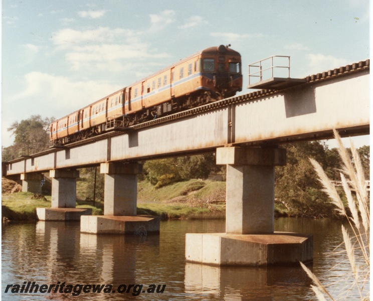 P16340
ADG class railcar set, on concrete and steel bridge, crossing Swan River, Guildford, ER line, side and end view
