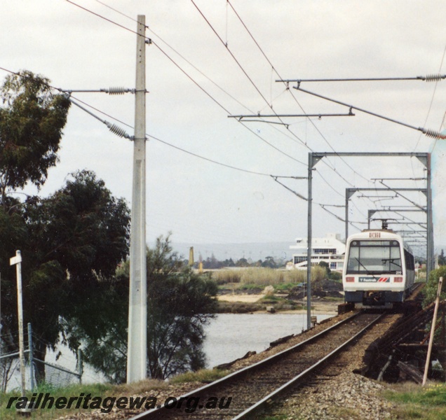 P16341
EMU railcar set, crossing Swan River on Bunbury bridge, East Perth, SWR line, front on view, c1997
