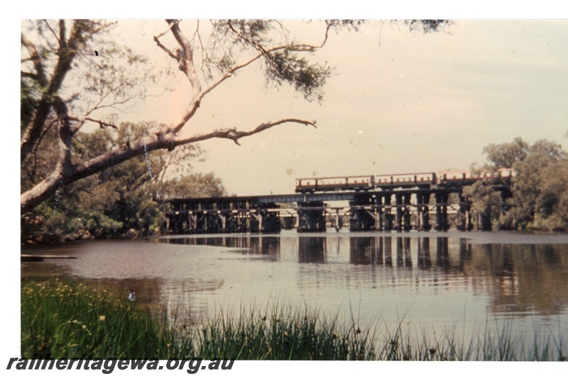 P16349
ADG class railcar set with ADY class centre coach, crossing wooden bridge over Swan River, Guildford, ER line, side on view 
