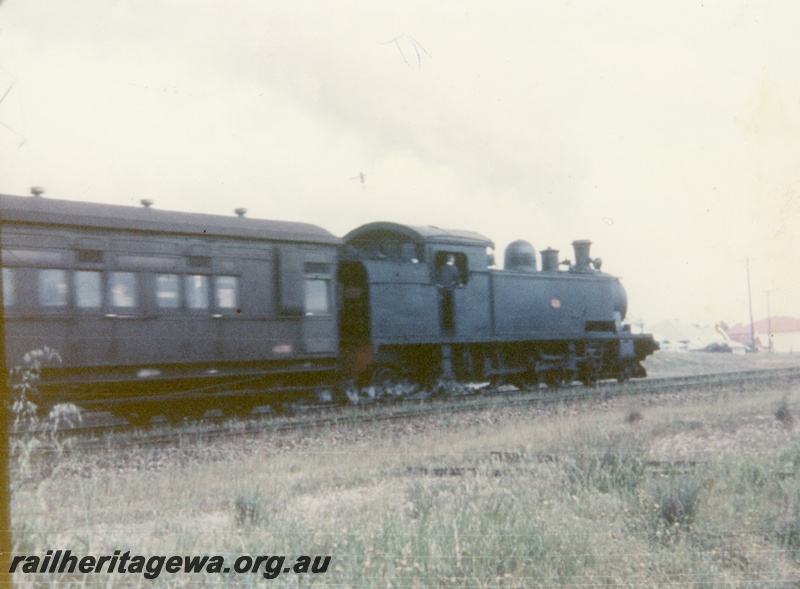 P16352
D class loco, on suburban passenger train, end and side view
