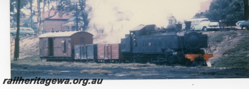 P16353
DD class 591, on goods train comprising two GE class wagons  and van, one an ex MRWA AE class in MRWA livery, side and front view
