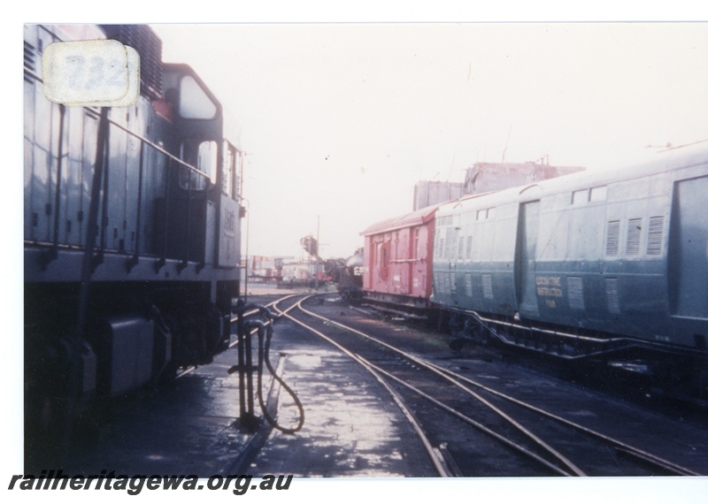 P16366
Diesel loco, vans including loco instruction van (ex ADF class), track level side views, East Perth Loco Depot
