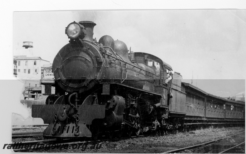 P16402
PR class loco, on hike train, commercial buildings in background, Perth, trackside view
