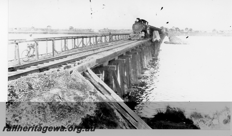 P16410
F class loco on coal train, crossing wooden trestle Bunbury bridge, East Perth, SWR line, c1927
