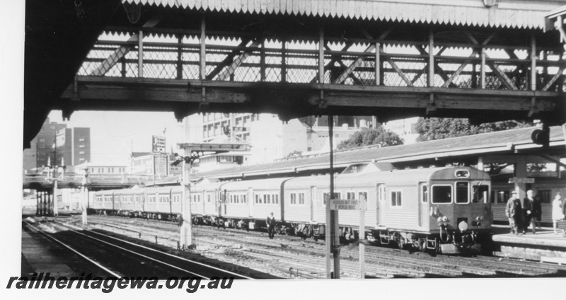 P16417
ADK class railcars, ADB class trailers, bracket signals, road bridge, footbridge, platform, canopy, Perth city station, side and end view
