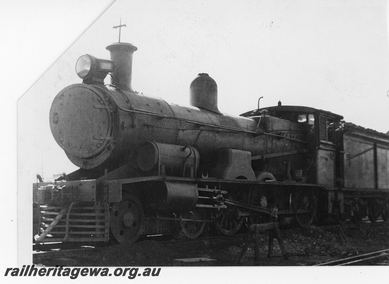 P16465
Commonwealth Railways (CR) G class 24, with smokebox door ajar, TAR line, front and side view
