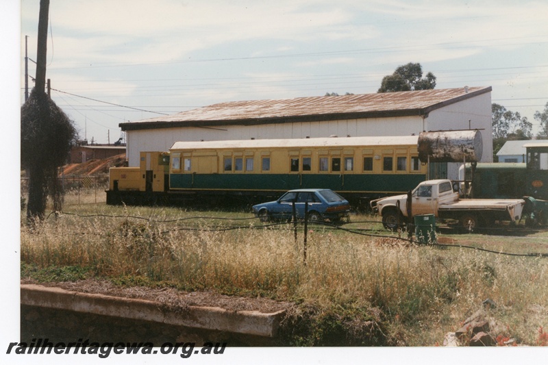 P16484
Z class 1153 in green with white ends, green and cream passenger car, yellow diesel loco, oil tank, preserved at Boulder Loop Line rail museum, side views
