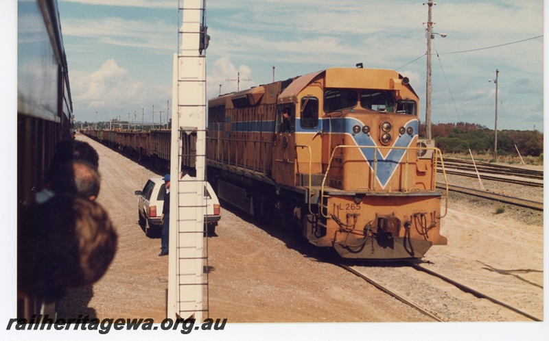 P16508
L class 265, in Westrail orange with blue and white stripe, on freight train, signal post, Leighton yard, ER line, view from passing excursion train
