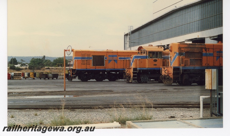 P16510
AA class diesel, two other diesel locos, all in Westrail orange with blue and white stripes, diesel shed, Forrestfield loco depot, side views
