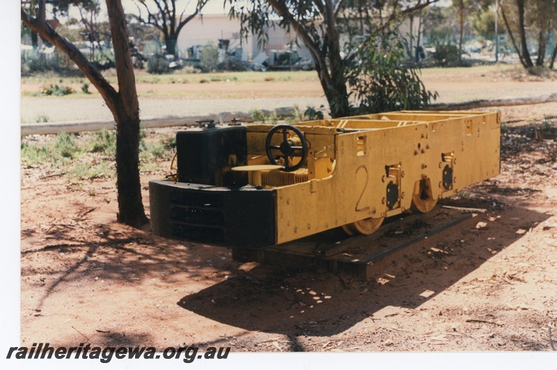 P16519
Motorised mine trolley, yellow, in preservation at Norseman museum, end and side view
