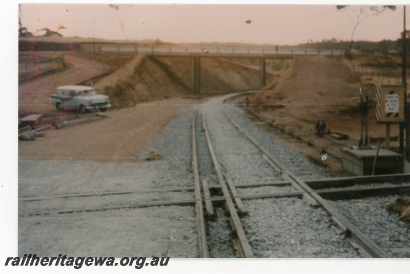 P16526
Crossing of narrow gauge line over dual gauge tracks under construction on the Avon Valley line, overhead bridge, ground lever frame, Toodyay, CM line 
