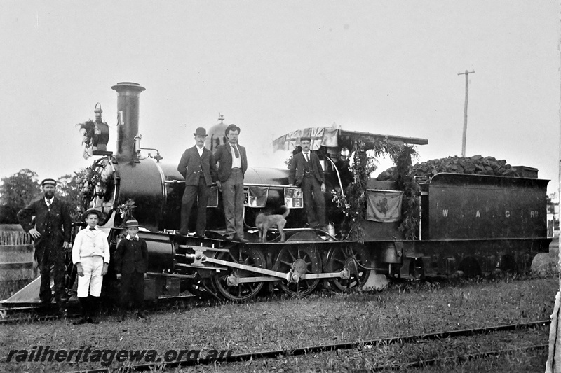 P16623
A class 31, decorated with flags and foliage, with various onlookers, Busselton, BB line, front and side view, c1897-1899
