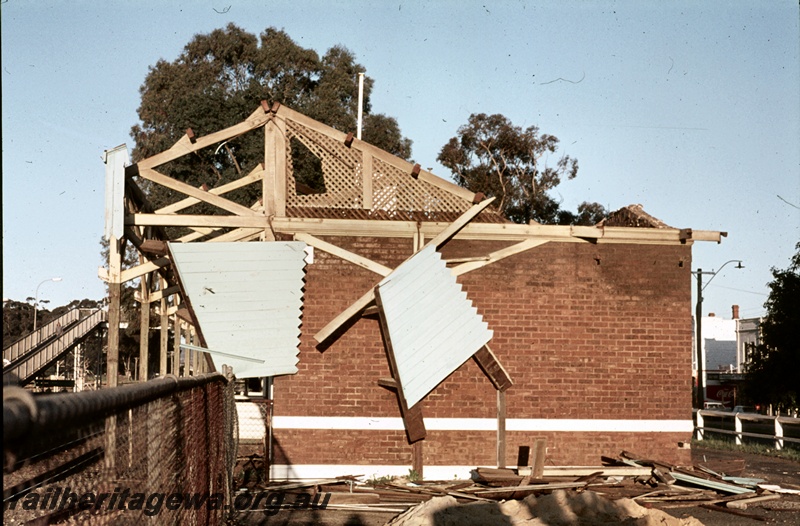 P16657
2 of 2 images of station building, Guildford, ER line, being demolished, pedestrian ramp, ground level view
