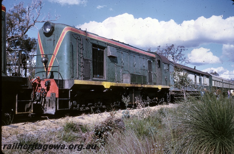 P16661
Ex MRWA F class 41, in green with red and yellow stripe livery, end and side view
